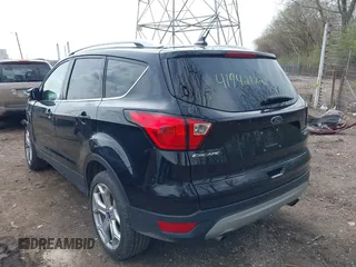 2019 Ford Escape Titanium with VIN 1FMCU9J91KUC42161, listed as a IAAI auction lot 41942122 with 100,677 mi miles and . Bid and sale history available at DreamBid. Image 3.