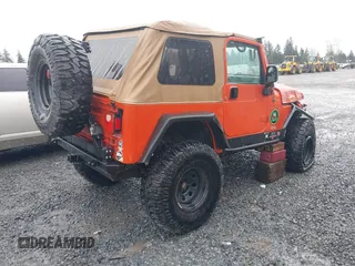 2006 Jeep Wrangler SE with VIN 1J4FA29S46P738370, listed as a IAAI auction lot 41825273 with 163,267 mi miles. Bid and sale history available at carsss.com. Image 4.