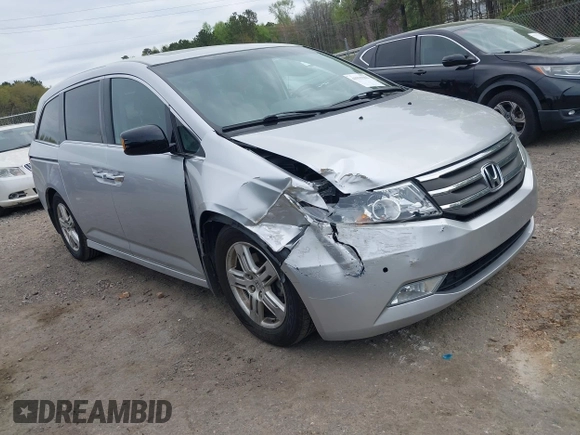 2012 Honda Odyssey Touring with VIN 5FNRL5H98CB026754, listed as a IAAI auction lot 41935562 with 165,626 mi miles. Bid and sale history available at carsss.com. Image 1.