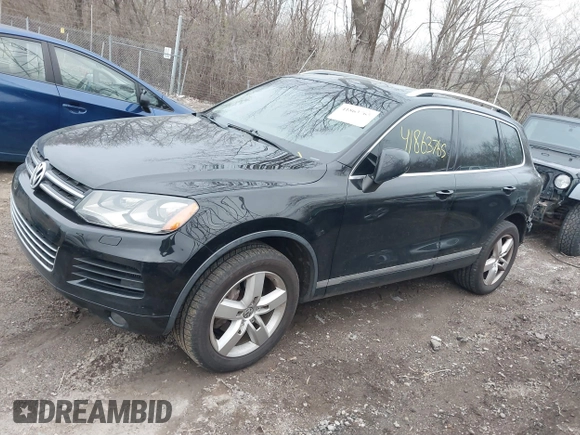 2012 Volkswagen Touareg Sport with VIN WVGFK9BP7CD002243, listed as a IAAI auction lot 41863765 with 136,231 mi miles and . Bid and sale history available at DreamBid. Image 18.