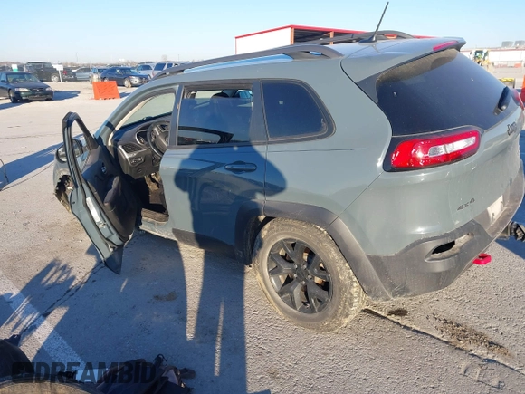 2015 Jeep Cherokee Trailhawk with VIN 1C4PJMBSXFW614416, listed as a IAAI auction lot 41033241 with 112,015 mi miles. Bid and sale history available at carsss.com. Image 3.