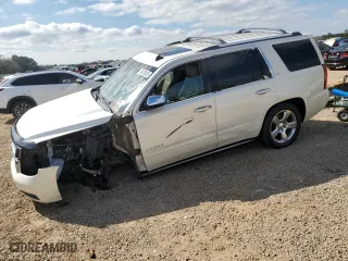 2015 Chevrolet Tahoe LTZ with VIN 1GNSCCKCXFR102314, listed as a Copart auction lot 48479825 with 218,901 mi miles and Salvage Title. Bid and sale history available at carsss.com. Image 1.