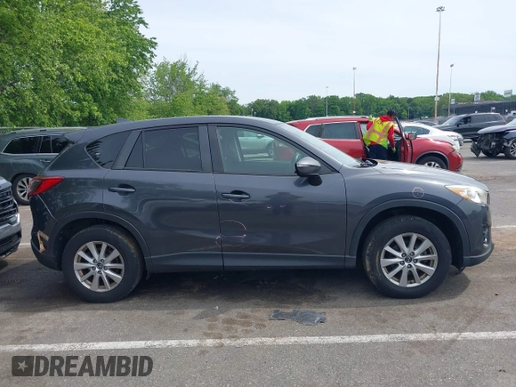 2016 Mazda CX-5 Touring z VIN JM3KE4CY4G0692655, wystawiony jako IAAI lot #42318657 z przebiegiem 212 826 mil mil oraz . Historia ofert i sprzedaży dostępna na DreamBid. Obrazek 13.