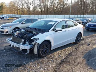 2018 Ford Fusion SE z VIN 3FA6P0H77JR108212, wystawiony jako IAAI lot #41208435 z przebiegiem 68 825 mil mil oraz . Historia ofert i sprzedaży dostępna na DreamBid. Obrazek 18.