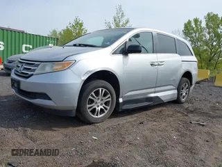 2011 Honda Odyssey EX-L with VIN 5FNRL5H61BB067456, listed as a IAAI auction lot 42131999 with 150,358 mi miles and . Bid and sale history available at carsss.com. Image 2.