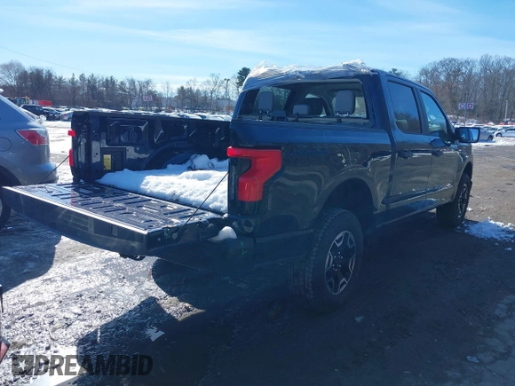 2023 Ford F-150 Lightning Pro with VIN 1FTVW1EL7PWG07081, listed as a IAAI auction lot 38702102 with 9,976 mi miles and . Bid and sale history available at DreamBid. Image 4.