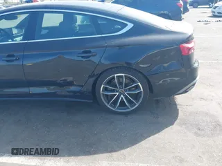 2023 Audi A5 Sportback S line Premium Plus z VIN WAUFACF52PA015824, wystawiony jako IAAI lot #42151635 z przebiegiem 24 509 mil mil oraz . Historia ofert i sprzedaży dostępna na DreamBid. Obrazek 6.