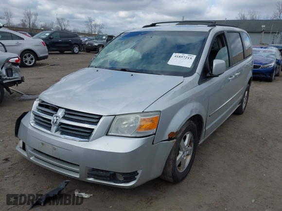 2010 Dodge Grand Caravan SXT with VIN 2D4RN5D13AR180609, listed as a IAAI auction lot 41857215 with Not Provided miles and . Bid and sale history available at DreamBid. Image 2.