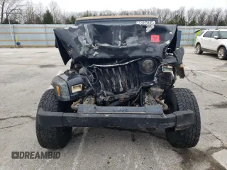 2000 Jeep Wrangler SE with VIN 1J4FA29PXYP746021, listed as a Copart auction lot 51023485 with 0 mi miles and Salvage Title. Bid and sale history available at carsss.com. Image 5.