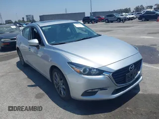 2018 Mazda 3 Touring z VIN 3MZBN1V35JM272638, wystawiony jako IAAI lot #42458722 z przebiegiem 98 393 mil mil oraz . Historia ofert i sprzedaży dostępna na DreamBid. Obrazek 1.