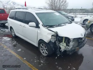 2015 Toyota Sienna SE with VIN 5TDXK3DC5FS583833, listed as a IAAI auction lot 41577726 with 143,965 mi miles. Bid and sale history available at carsss.com. Image 1.