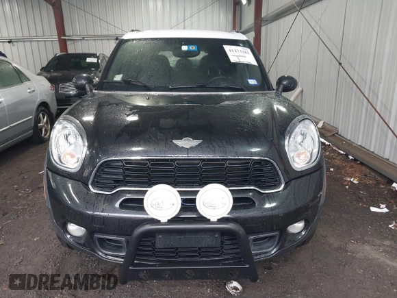 2014 MINI Countryman S with VIN WMWZC5C53EWP40677, listed as a IAAI auction lot 41473281 with 108,616 mi miles and . Bid and sale history available at DreamBid. Image 12.