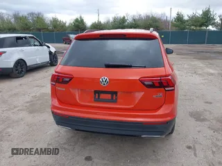2018 Volkswagen Tiguan S z VIN 3VV0B7AX4JM124500, wystawiony jako IAAI lot #41974671 z przebiegiem 76 970 mil mil oraz . Historia ofert i sprzedaży dostępna na DreamBid. Obrazek 16.