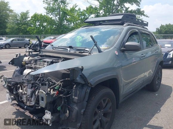 2015 Jeep Cherokee Trailhawk with VIN 1C4PJMBB0FW528421, listed as a IAAI auction lot 42591132 with 166,425 mi miles and . Bid and sale history available at DreamBid. Image 18.