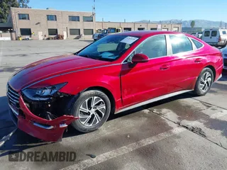 2020 Hyundai Sonata Hybrid Blue with VIN KMHL24JJ1LA009550, listed as a IAAI auction lot 41265226 with 85,347 mi miles. Bid and sale history available at carsss.com. Image 2.