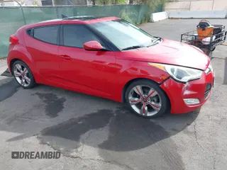 2013 Hyundai Veloster w/Black Int with VIN KMHTC6AD7DU117562, listed as a IAAI auction lot 41993745 with 106,780 mi miles. Bid and sale history available at carsss.com. Image 1.