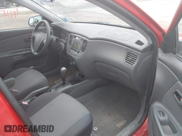2009 Kia Rio SX with VIN KNADE223996556806, listed as a IAAI auction lot 42117938 with 54,007 mi miles. Bid and sale history available at carsss.com. Image 5.