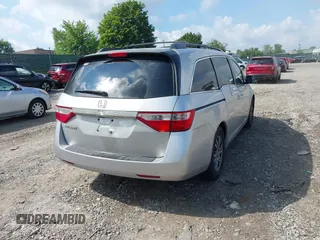 2012 Honda Odyssey EX-L with VIN 5FNRL5H61CB081634, listed as a IAAI auction lot 42760909 with 197,949 mi miles and . Bid and sale history available at DreamBid. Image 4.