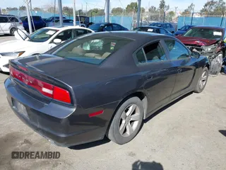 2013 Dodge Charger SE with VIN 2C3CDXBGXDH688230, listed as a IAAI auction lot 41634325 with 133,519 mi miles. Bid and sale history available at carsss.com. Image 4.