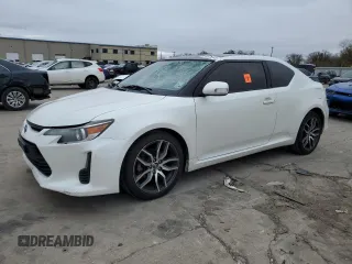 2016 Scion tC with VIN JTKJF5C73GJ019812, listed as a Copart auction lot 84228844 with 153,692 mi miles and Salvage Title. Bid and sale history available at carsss.com. Image 1.
