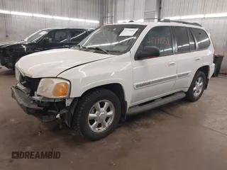 2003 GMC Envoy SLT with VIN 1GKDT13S332222847, listed as a IAAI auction lot 41771052 with 203,699 mi miles. Bid and sale history available at carsss.com. Image 2.