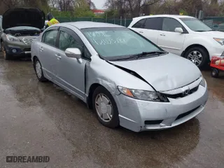 2010 Honda Civic Hybrid with VIN JHMFA3F23AS007725, listed as a IAAI auction lot 42023784 with 230,656 mi miles. Bid and sale history available at carsss.com. Image 1.