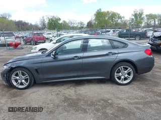 2015 BMW 4 Series 428i xDrive z VIN WBA4A7C5XFD415131, wystawiony jako IAAI lot #42100618 z przebiegiem 89 093 mil mil oraz . Historia ofert i sprzedaży dostępna na DreamBid. Obrazek 14.