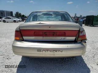 1999 Saturn SL with VIN 1G8ZK5271XZ226783, listed as a Copart auction lot 56467315 with 86,168 mi miles and Salvage title. Bid and sale history available at DreamBid. Image 6.