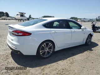 2020 Ford Fusion Titanium с VIN 3FA6P0K99LR174094, выставлен на аукционе Copart как лот 52583435 с пробегом 98 389 миль миль и Списание • Salvage title. История ставок и продаж доступна на DreamBid. Изображение 3.