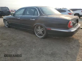 2004 Jaguar XJ with VIN SAJWA73B74TG18082, listed as a Copart auction lot 70516404 with 0 mi miles and Salvage Title. Bid and sale history available at carsss.com. Image 2.
