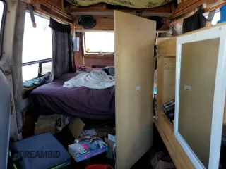 1994 GMC Vandura z VIN 1GDEG25KXRF519134, wystawiony jako Copart lot #75056124 z przebiegiem 245 597 mil mil oraz Szkody całkowita. Historia ofert i sprzedaży dostępna na DreamBid. Obrazek 10.