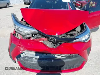 2020 Toyota C-HR LE with VIN JTNKHMBX3L1066720, listed as a IAAI auction lot 42042139 with 98,925 mi miles and . Bid and sale history available at DreamBid. Image 6.