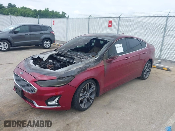 2019 Ford Fusion Titanium с VIN 3FA6P0D96KR152789, выставлен на аукционе IAAI как лот 42523192 с пробегом Не указан миль и . История ставок и продаж доступна на DreamBid. Изображение 2.