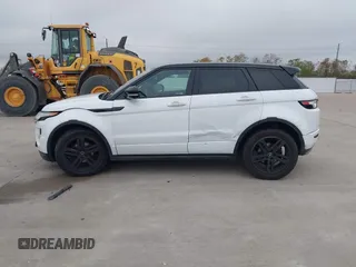 2013 Land Rover Range Rover Evoque Dynamic Premium z VIN SALVT2BG3DH741262, wystawiony jako IAAI lot #41059302 z przebiegiem Nie podano mil oraz . Historia ofert i sprzedaży dostępna na DreamBid. Obrazek 14.