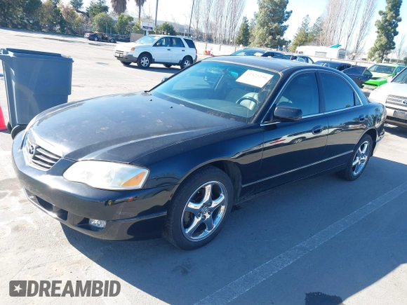 2002 Mazda Millenia S z VIN JM1TA222421728535, wystawiony jako IAAI lot #41525259 z przebiegiem 131 870 mil mil oraz . Historia ofert i sprzedaży dostępna na DreamBid. Obrazek 2.