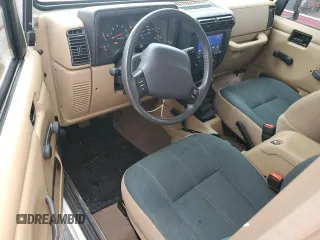 2002 Jeep Wrangler Sahara with VIN 1J4FA59S02P727359, listed as a Copart auction lot 74823414 with 84,186 mi miles and Salvage Title. Bid and sale history available at carsss.com. Image 8.