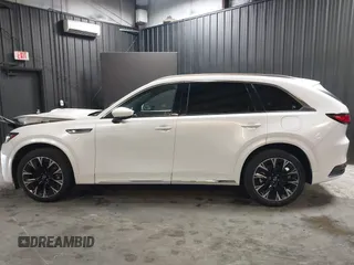 2024 Mazda CX-90 S Premium z VIN JM3KKDHCXR1103272, wystawiony jako IAAI lot #40301969 z przebiegiem 5 235 mil mil oraz . Historia ofert i sprzedaży dostępna na DreamBid. Obrazek 15.
