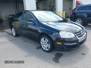 2007 Volkswagen Jetta 2.5 z VIN 3VWSF71K67M104593, wystawiony jako IAAI lot #42512355 z przebiegiem 158 409 mil mil oraz . Historia ofert i sprzedaży dostępna na DreamBid. Obrazek 1.