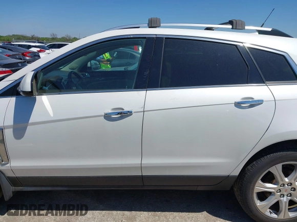 2014 Cadillac SRX Performance Collection with VIN 3GYFNFE35ES582897, listed as a IAAI auction lot 41978361 with 144,116 mi miles and . Bid and sale history available at DreamBid. Image 14.