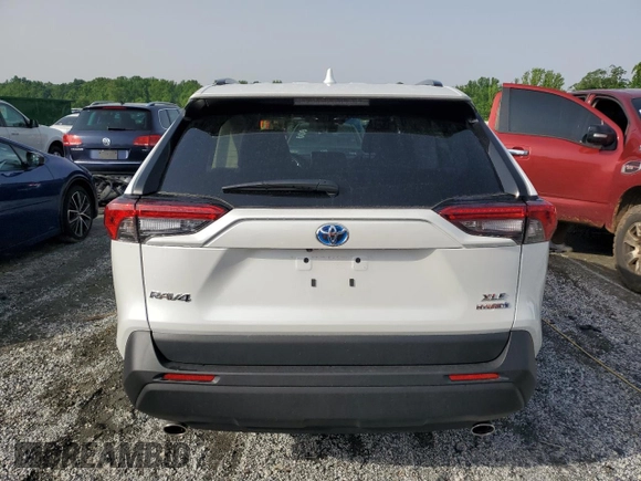 2024 Toyota RAV4 Hybrid XLE Premium with VIN 4T3B6RFV1RU174487, listed as a Copart auction lot 57208645 with 9,911 mi miles and Salvage title. Bid and sale history available at DreamBid. Image 6.