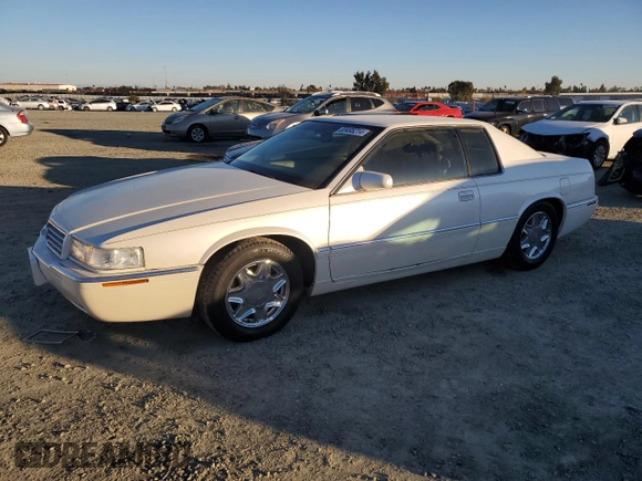 2002 Cadillac Eldorado z VIN 1G6EL12Y12B100821, wystawiony jako Copart lot #83495214 z przebiegiem 36 358 mil mil oraz Czysty tytuł • Clean title. Historia ofert i sprzedaży dostępna na DreamBid. Obrazek 1.
