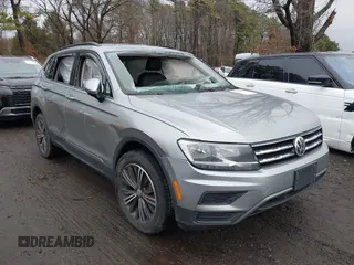 2021 Volkswagen Tiguan SE with VIN 3VV2B7AX8MM100651, listed as a IAAI auction lot 41803931 with 69,405 mi miles and . Bid and sale history available at DreamBid. Image 1.