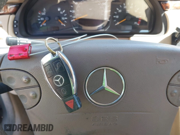 2002 Mercedes-Benz E-Class with VIN WDBJF65J42B394017, listed as a IAAI auction lot 41706917 with 188,883 mi miles. Bid and sale history available at carsss.com. Image 11.