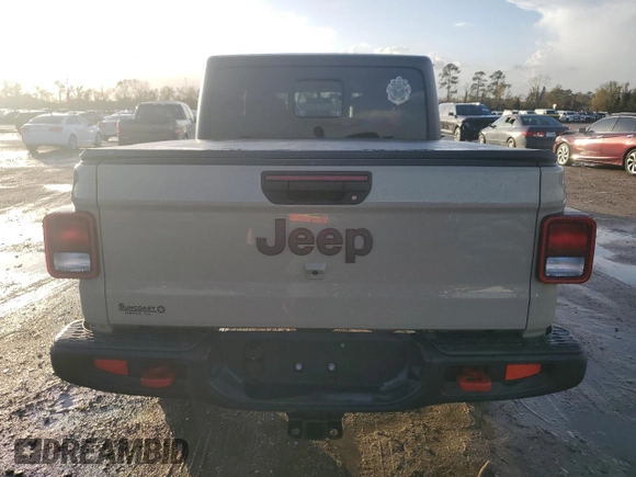 2022 Jeep Gladiator Rubicon z VIN 1C6JJTBG3NL174980, wystawiony jako Copart lot #85774884 z przebiegiem Nie podano mil oraz Nie do naprawy • Non repairable. Historia ofert i sprzedaży dostępna na DreamBid. Obrazek 6.