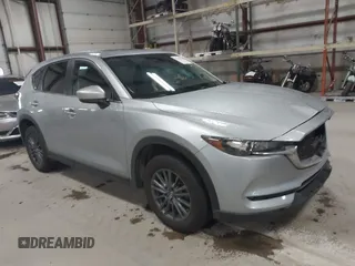 2020 Mazda CX-5 Touring with VIN JM3KFBCMXL0784653, listed as a IAAI auction lot 41817904 with 71,513 mi miles and . Bid and sale history available at carsss.com. Image 1.