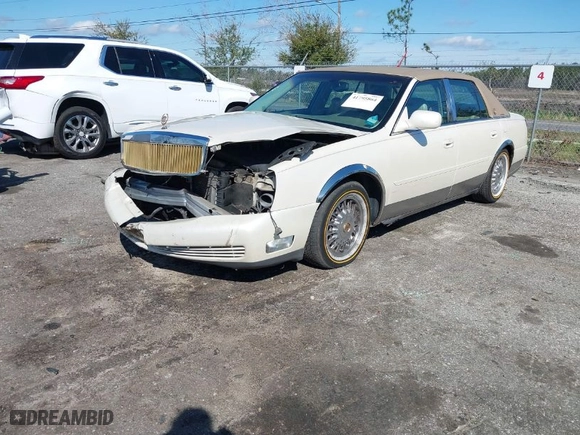 2001 Cadillac DeVille with VIN 1G6KD54Y91U230997, listed as a IAAI auction lot 41795864 with 379,025 mi miles. Bid and sale history available at carsss.com. Image 2.