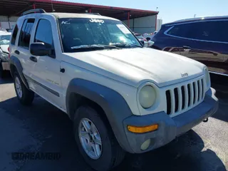 2002 Jeep Liberty Sport with VIN 1J8GL48KX2W153948, listed as a IAAI auction lot 41843882 with 180,677 mi miles. Bid and sale history available at carsss.com. Image 1.