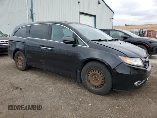 2015 Honda Odyssey Touring Elite with VIN 5FNRL5H91FB504095, listed as a Copart auction lot 53868125 with 176,272 mi miles and Salvage Title. Bid and sale history available at DreamBid. Image 4.