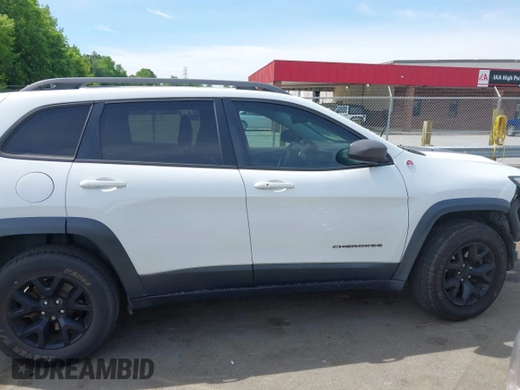 2016 Jeep Cherokee Trailhawk z VIN 1C4PJMBS7GW109189, wystawiony jako IAAI lot #42219470 z przebiegiem 115 197 mil mil oraz . Historia ofert i sprzedaży dostępna na DreamBid. Obrazek 12.