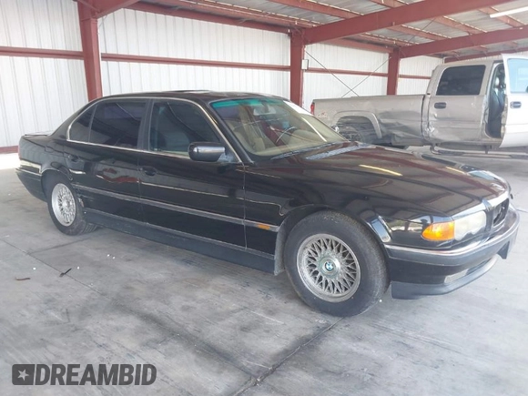 1999 BMW 7 Series 740il with VIN WBAGH8336XDP03839, listed as a IAAI auction lot 42067133 with 163,345 mi miles. Bid and sale history available at carsss.com. Image 1.